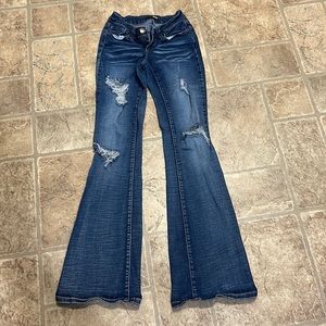 Distressed boot cut jeans